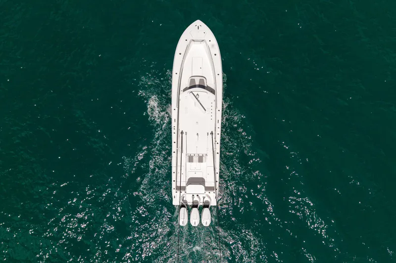 Slide: The Image of Aerial view of 2023 Invincible 36 Open Fisherman boat on clear blue water. - 1