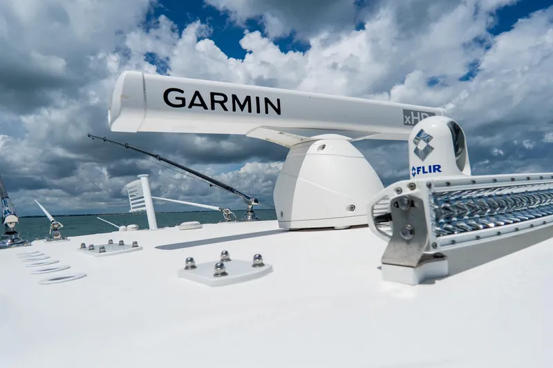 Slide: The Image of 2023 Invincible 36 Open Fisherman boat with Garmin radar and FLIR system under cloudy sky. - 11