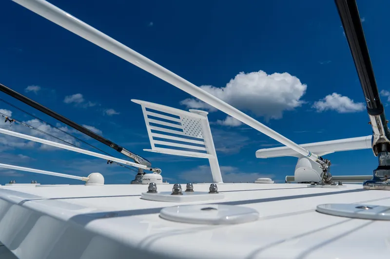 Slide: The Image of 2023 Invincible 36 Open Fisherman boat deck with clear blue sky and clouds. - 12
