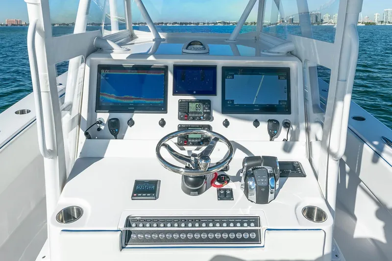 Slide: The Image of Manufacturer Provided Image: 2023 Invincible 36 Open Fisherman dashboard with advanced navigation and control systems. - 13
