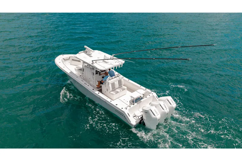 Slide: The Image of 2023 Invincible 36 Open Fisherman boat cruising on clear blue water. - 22