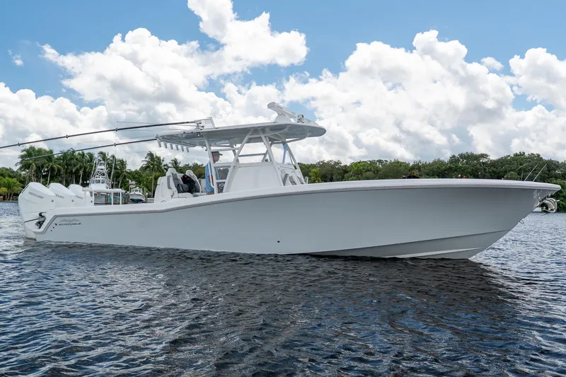 Slide: The Image of 2023 Invincible 36 Open Fisherman boat on water under a blue sky. - 24