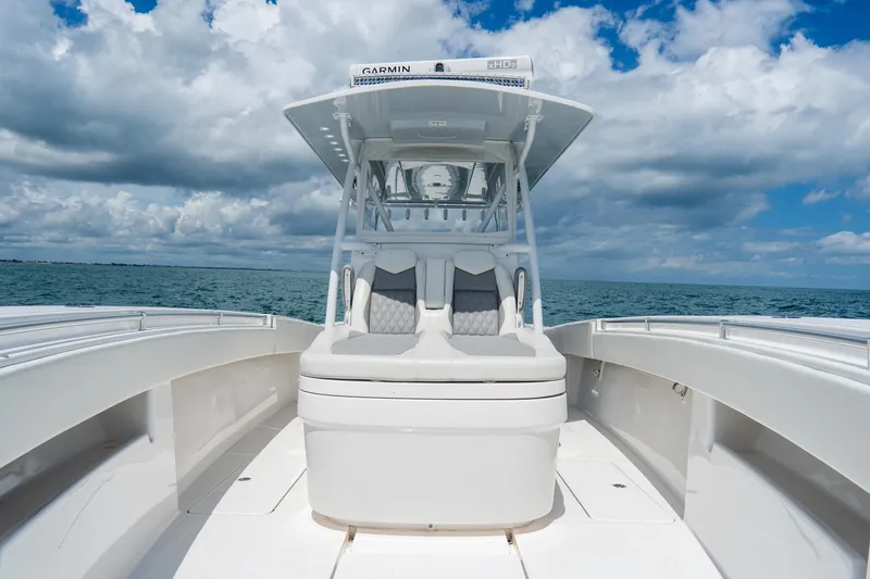 Slide: The Image of 2023 Invincible 36 Open Fisherman boat on open water under cloudy sky. - 8