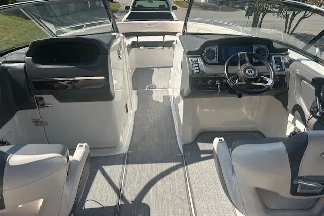 Slide: The Image of 2017 Chaparral 277 SSX boat interior with modern dashboard and seating. - 4