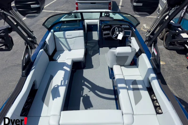 Slide: The Image of 2026 MasterCraft NXT22 boat interior with spacious seating and modern dashboard. - 7