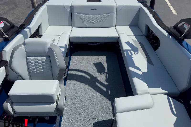 Slide: The Image of 2026 MasterCraft NXT22 boat interior with luxurious seating and modern design. - 9
