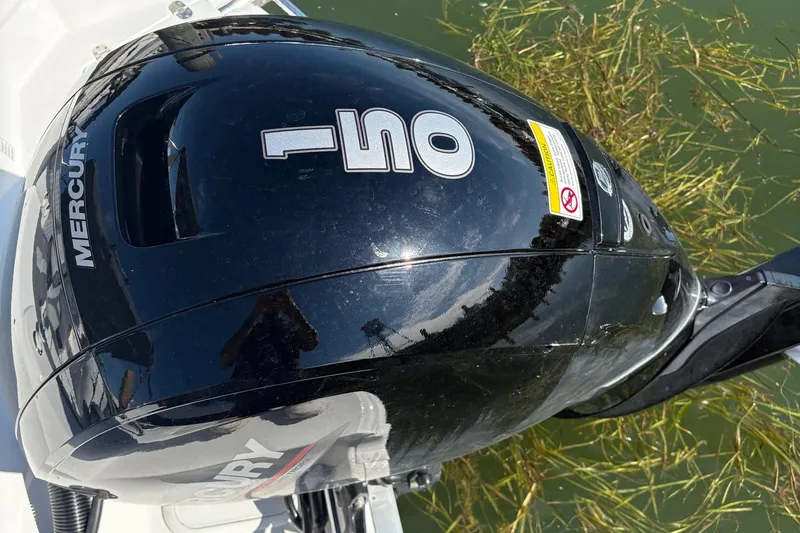 Slide: The Image of Mercury 150 outboard engine on 2026 NauticStar 223 DC Deck boat. - 4