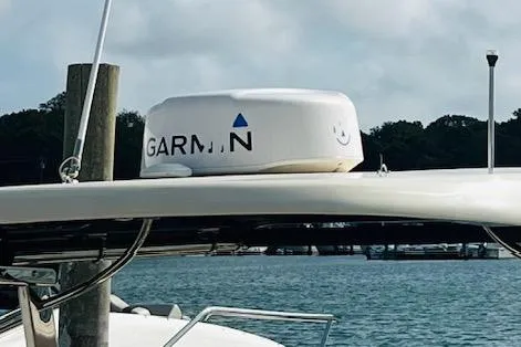 Slide: The Image of 2022 Chris-Craft Calypso 30 with Garmin radar on a sunny day by the water. - 13