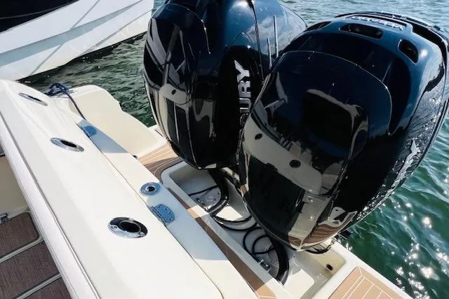 Slide: The Image of 2022 Chris-Craft Calypso 30 with dual Mercury outboard engines on water. - 16