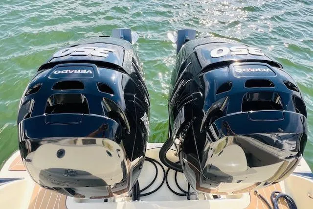 Slide: The Image of Twin 350 Verado engines on 2022 Chris-Craft Calypso 30, glistening over water. - 17