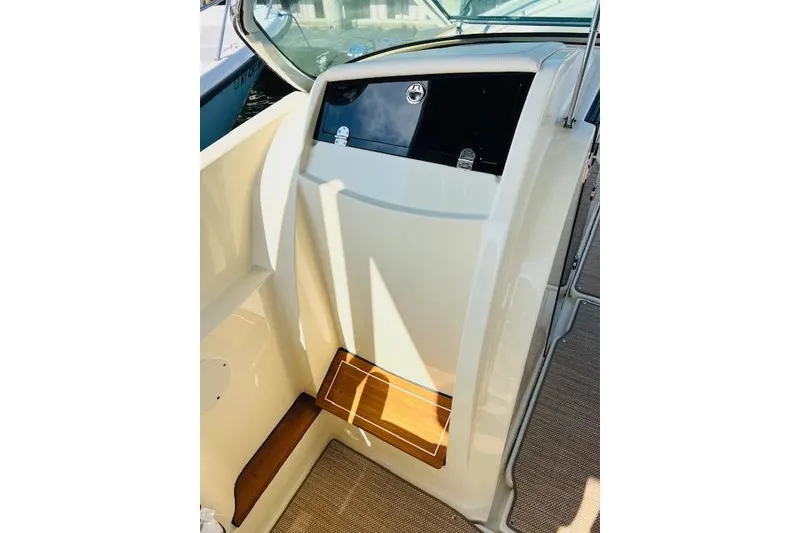 Slide: The Image of 2022 Chris-Craft Calypso 30 interior with sleek design and wooden accents. - 31