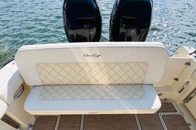 Slide: The Image of 2022 Chris-Craft Calypso 30 boat with elegant seating and dual engines on water. - 41