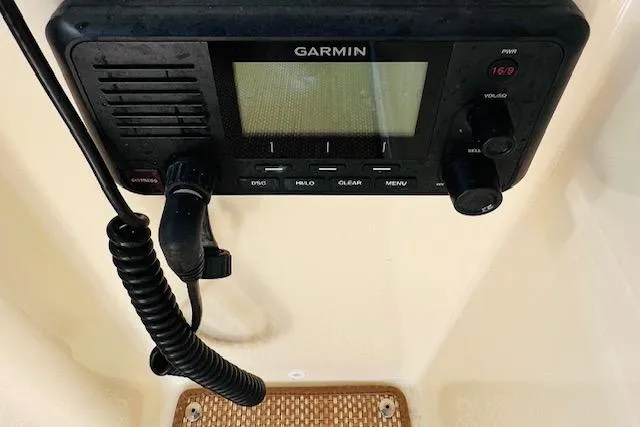 Slide: The Image of Garmin marine radio on 2022 Chris-Craft Calypso 30 boat dashboard. - 49