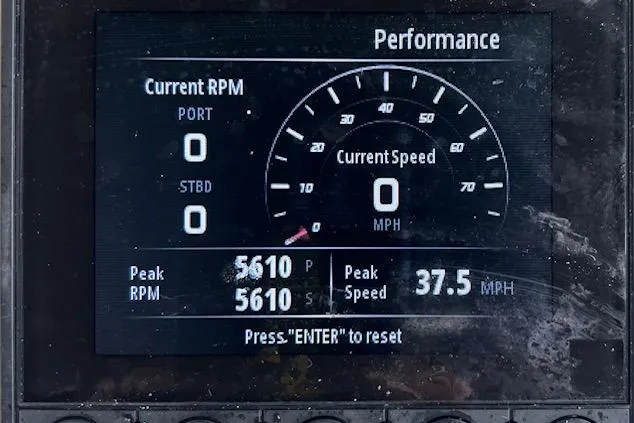 Slide: The Image of Display screen showing performance metrics of a 2022 Chris-Craft Calypso 30 boat. - 52