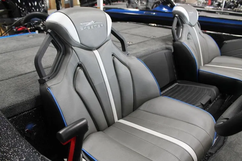 Slide: The Image of 2026 Skeeter ZXE20 boat interior with sleek gray seats and blue accents. - 6