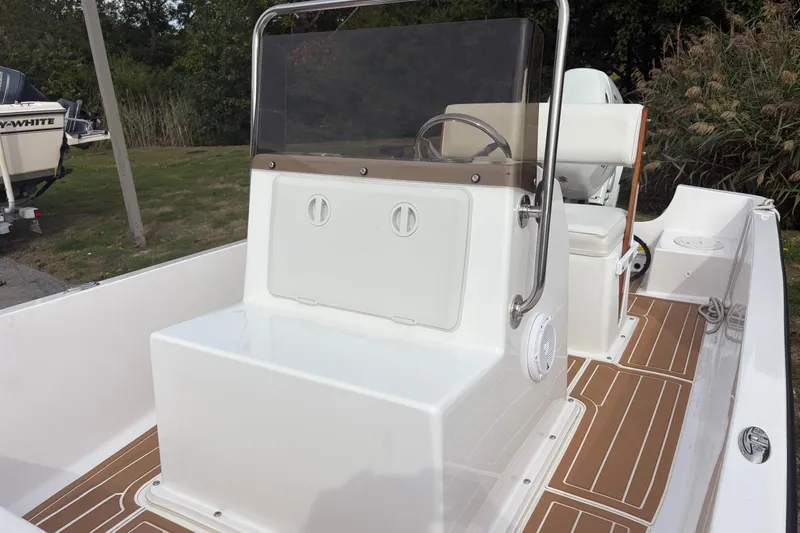 Slide: The Image of 2024 Wolfeboro 15 Classic boat interior with sleek console and seating. - 10