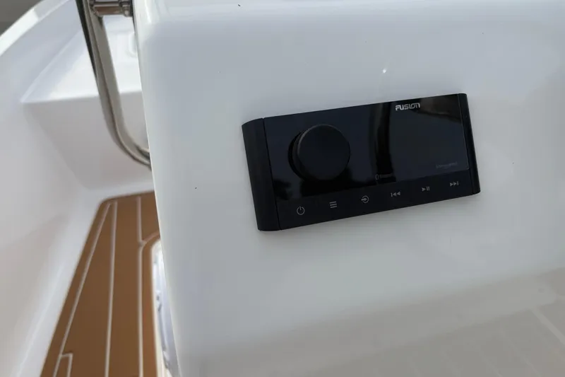 Slide: The Image of 2024 Wolfeboro 15 Classic boat with Fusion audio system on white panel. - 14