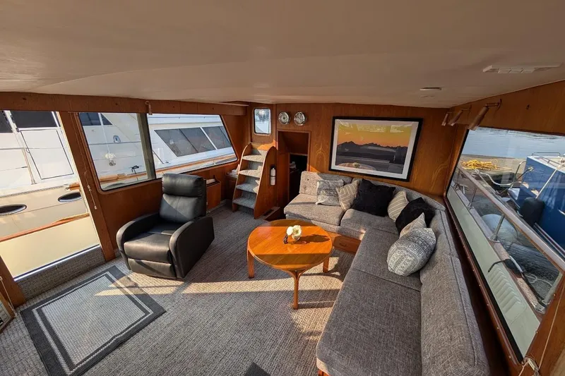 Slide: The Image of Interior of 1978 Tollycraft 54 Custom Cockpit Motor Yacht with cozy seating and nautical decor. - 14