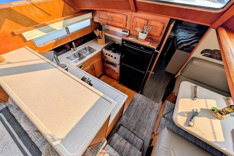 Slide: The Image of Interior of 1978 Tollycraft 54 Custom Cockpit Motor Yacht with kitchen and seating area. - 21