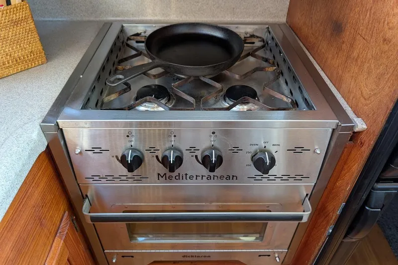 Slide: The Image of Stainless steel Mediterranean stove with cast iron pan on Tollycraft 54 Custom Cockpit Motor Yacht. - 28