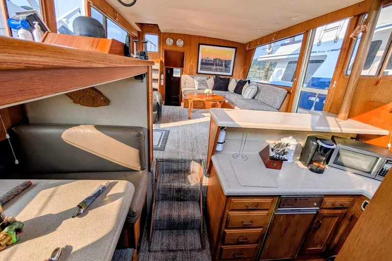 Slide: The Image of Interior of 1978 Tollycraft 54 Custom Cockpit Motor Yacht with cozy seating and kitchenette. - 29