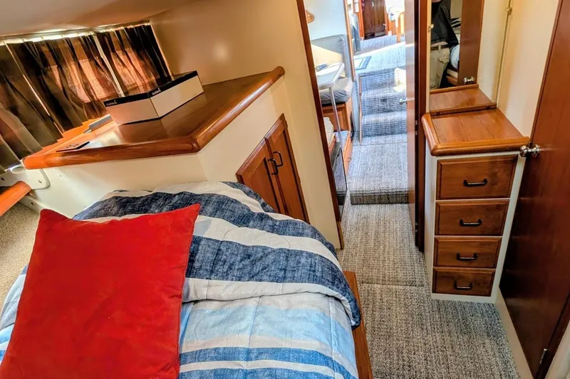 Slide: The Image of Interior of 1978 Tollycraft 54 Custom Cockpit Motor Yacht with cozy cabin and wooden furnishings. - 33