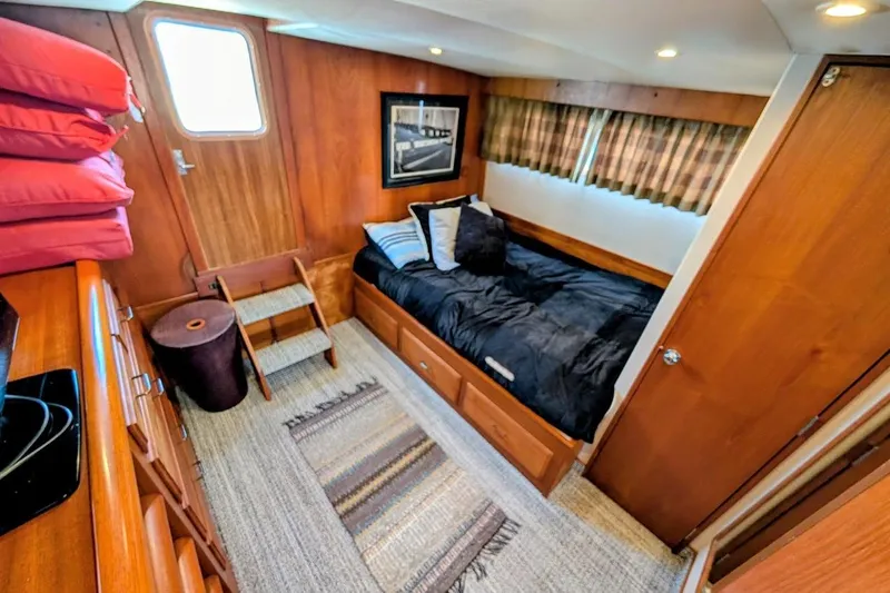 Slide: The Image of Cozy cabin interior of 1978 Tollycraft 54 Custom Cockpit Motor Yacht with wood paneling. - 37