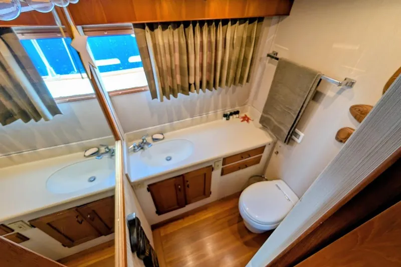 Slide: The Image of Bathroom interior of 1978 Tollycraft 54 Custom Cockpit Motor Yacht, featuring sink and toilet. - 40