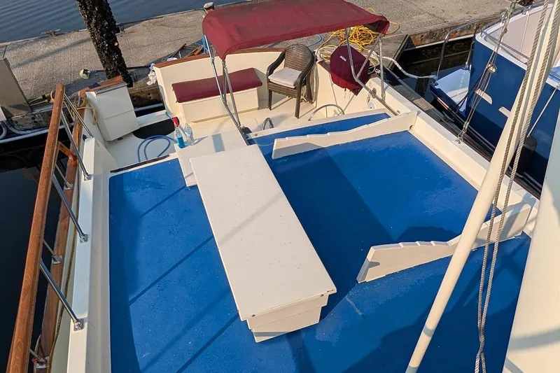Slide: The Image of 1978 Tollycraft 54 Custom Cockpit Motor Yacht with blue deck and seating area. - 45