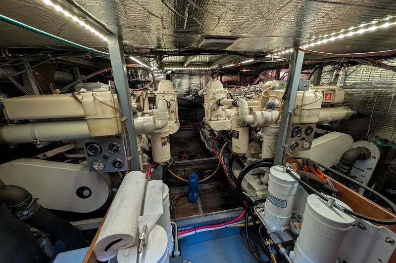 Slide: The Image of Engine room of 1978 Tollycraft 54 Custom Cockpit Motor Yacht with dual engines and equipment. - 51