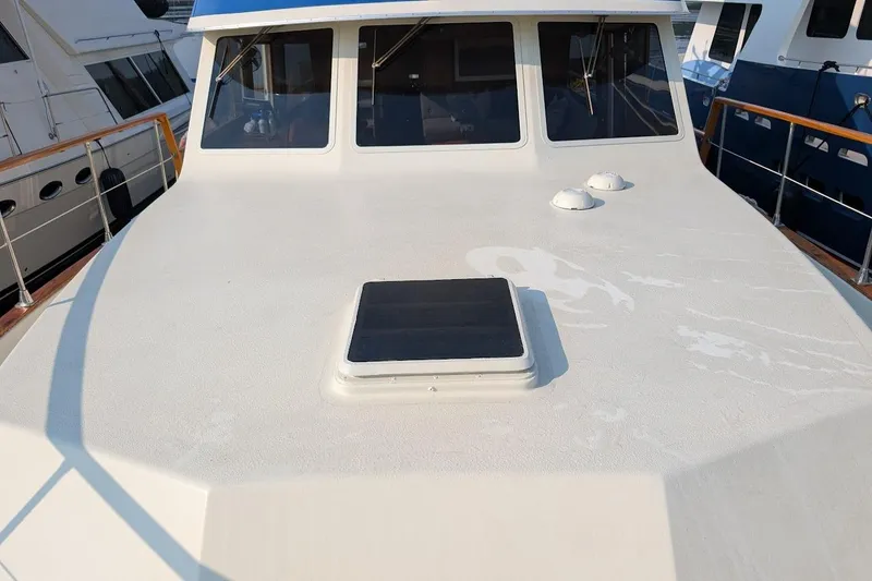 Slide: The Image of 1978 Tollycraft 54 Custom Cockpit Motor Yacht deck with windows and hatch. - 6
