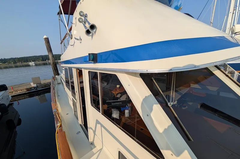 Slide: The Image of 1978 Tollycraft 54 Custom Cockpit Motor Yacht docked at marina, side view. - 7