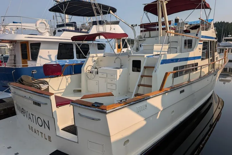 Slide: The Image of 1978 Tollycraft 54 Custom Cockpit Motor Yacht docked in marina, featuring spacious deck. - 8