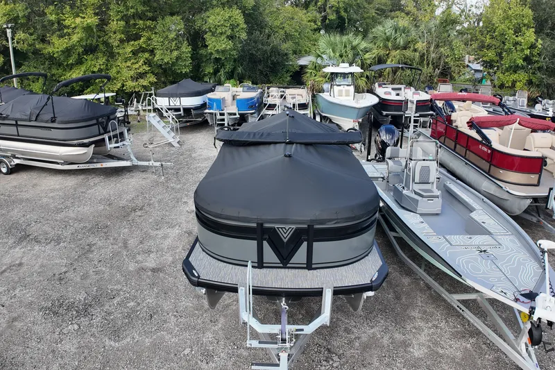 The Image of Outdoor display of various boats, featuring a 2026 Viaggio Lago X22U. - 0