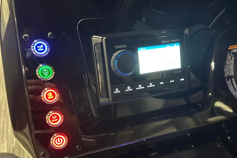 Slide: The Image of Control panel of 2026 Viaggio Lago X22U with Clarion audio system and illuminated buttons. - 21