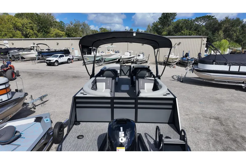 Slide: The Image of 2026 Viaggio Lago X22U pontoon boat with canopy in a marina setting. - 6