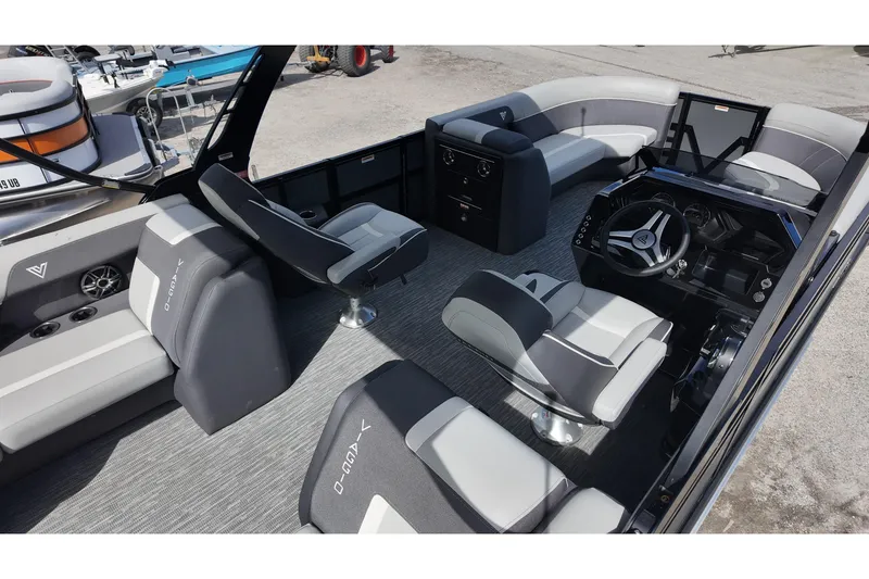 Slide: The Image of Interior of 2026 Viaggio Lago X22U boat with modern seating and steering console. - 9