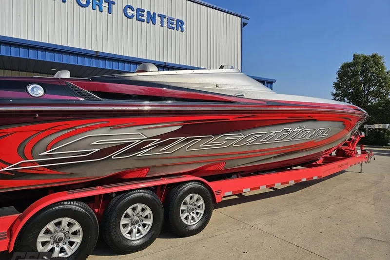 Slide: The Image of 2011 Sunsation F-4 speedboat on trailer outside transport center. - 10