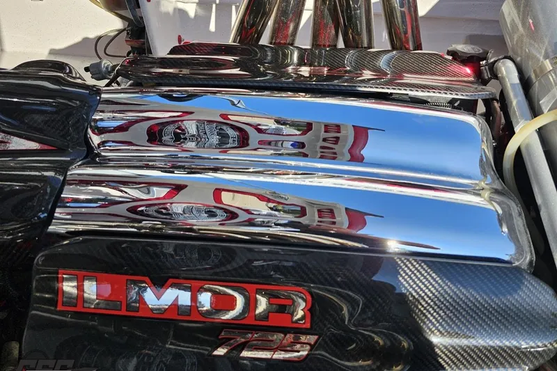 Slide: The Image of Chrome engine cover of a 2011 Sunsation F-4 with Ilmor 725 branding. - 100
