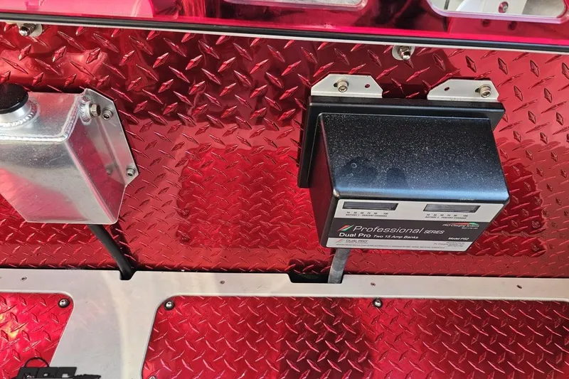 Slide: The Image of Red diamond plate surface with mounted Dual Pro charger on a 2011 Sunsation F-4. - 101