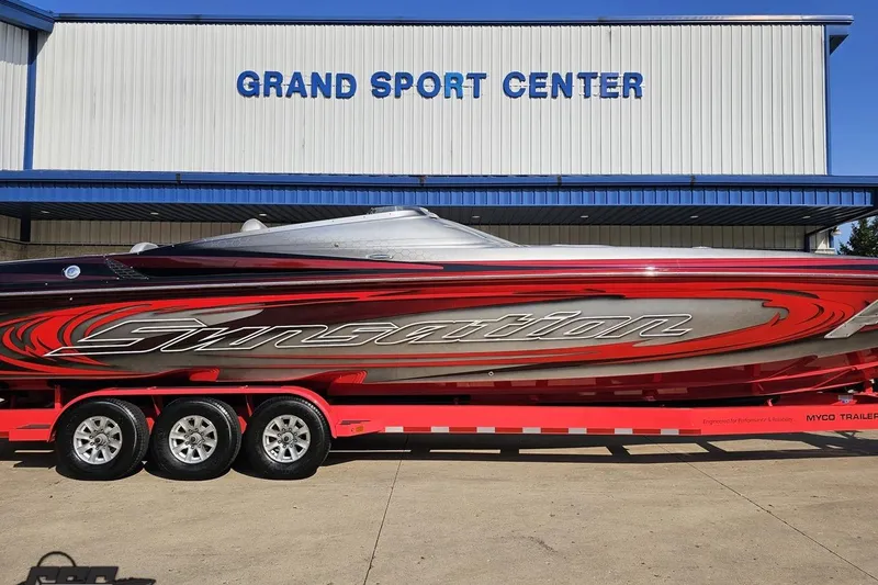 Slide: The Image of 2011 Sunsation F-4 boat with vibrant red design at Grand Sport Center. - 2