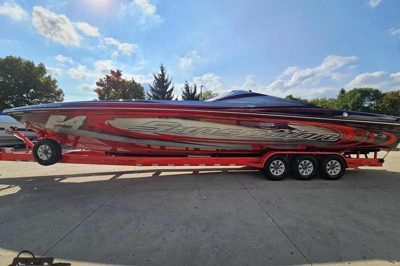 Slide: The Image of 2011 Sunsation F-4 speedboat on trailer under a clear blue sky. - 22