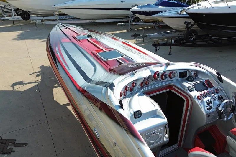 Slide: The Image of 2011 Sunsation F-4 powerboat with sleek design and advanced dashboard controls. - 33