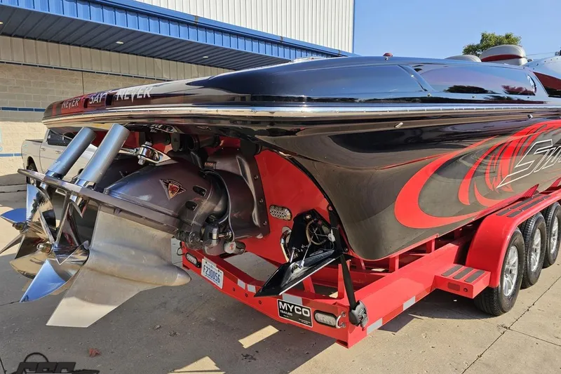 Slide: The Image of 2011 Sunsation F-4 powerboat on trailer, featuring sleek design and vibrant red accents. - 37