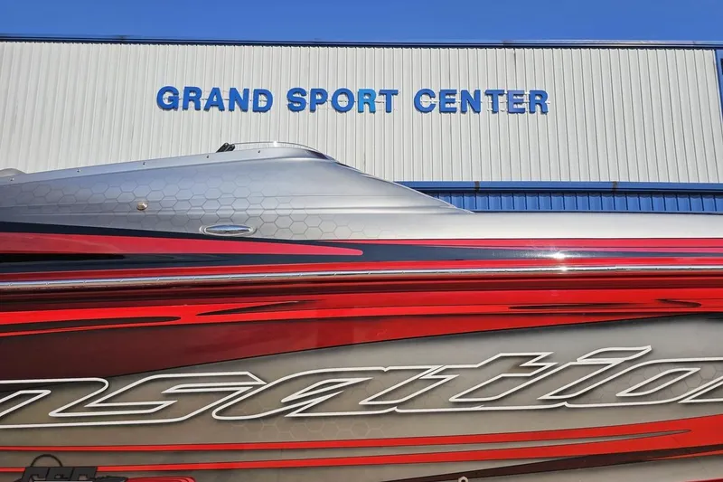 Slide: The Image of 2011 Sunsation F-4 boat at Grand Sport Center, featuring sleek red and silver design. - 4