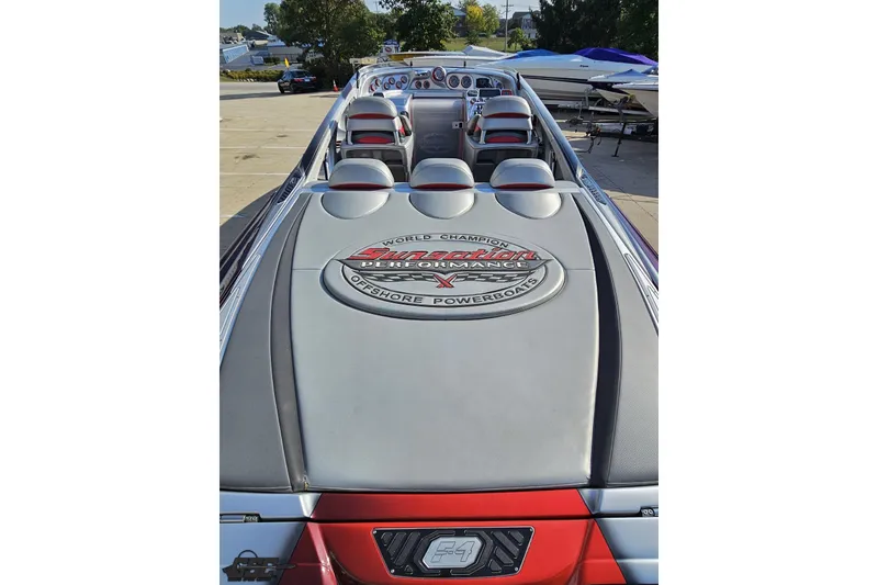 Slide: The Image of 2011 Sunsation F-4 powerboat interior with logo, showcasing sleek design and seating arrangement. - 42
