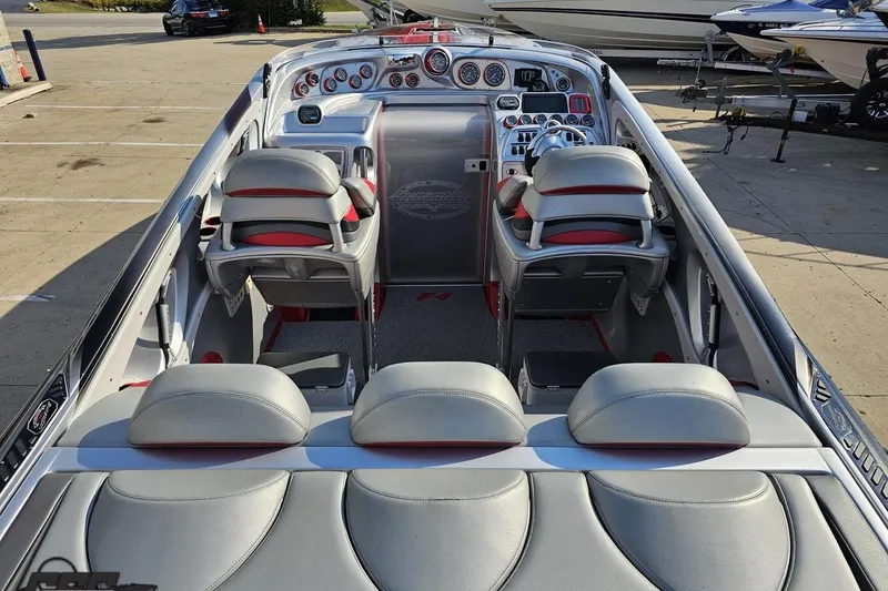 Slide: The Image of 2011 Sunsation F-4 boat interior with sleek seating and modern dashboard controls. - 47