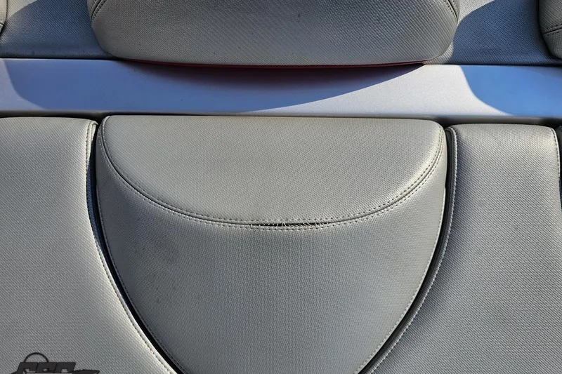 Slide: The Image of 2011 Sunsation F-4 boat seat upholstery, featuring gray textured fabric and sleek design. - 48