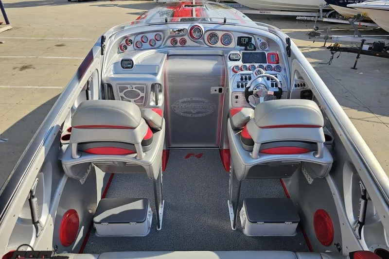 Slide: The Image of 2011 Sunsation F-4 boat interior with sleek dashboard and modern controls. - 49