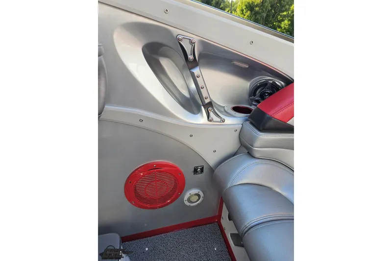 Slide: The Image of Interior of 2011 Sunsation F-4 boat with red speaker and leather seating. - 52